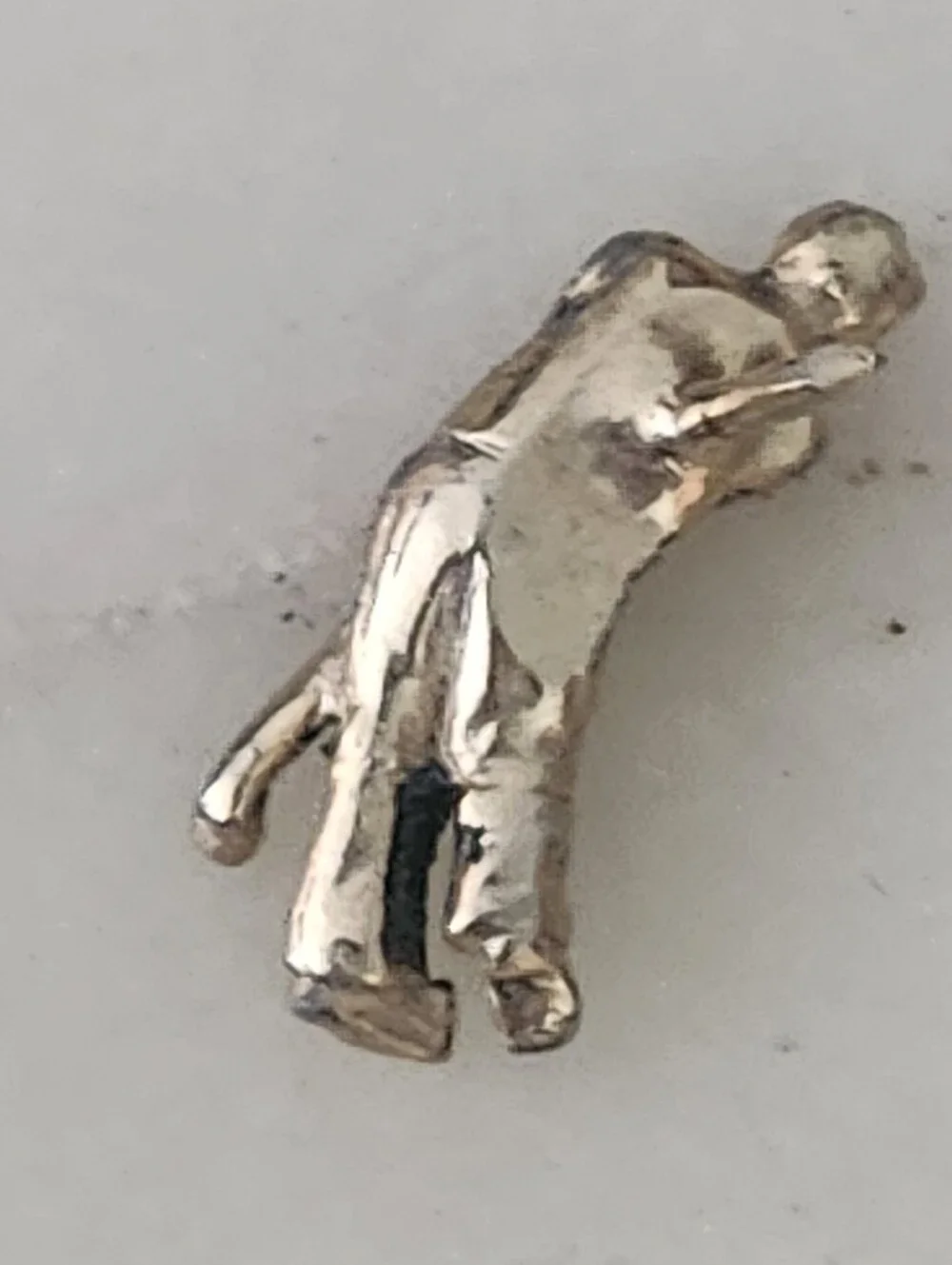 Gold-Tone Golfer Hitting Ball Figure Lapel Pin